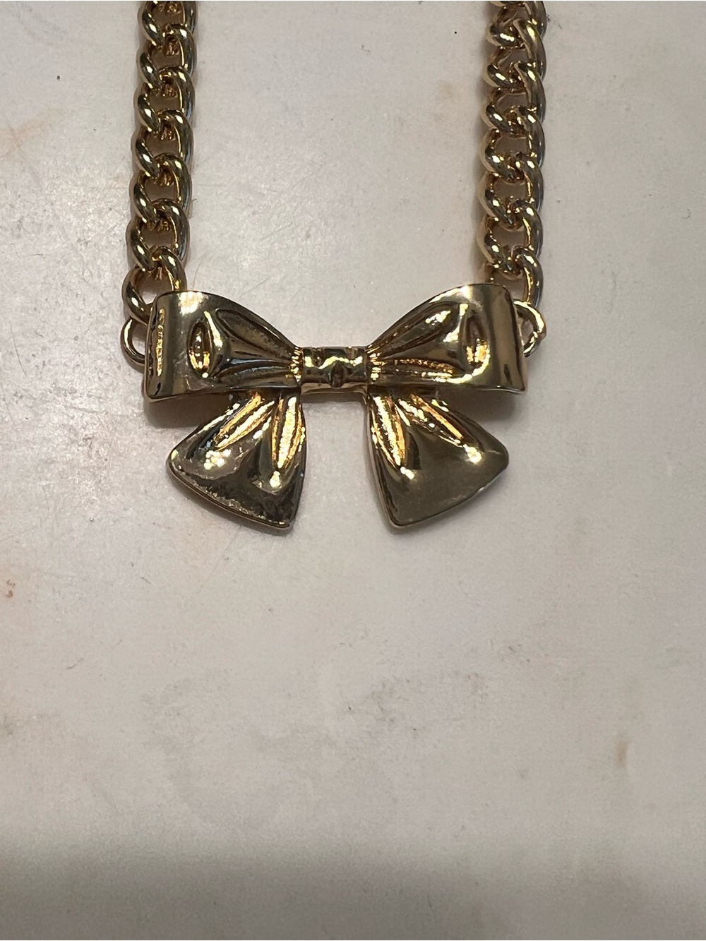 Gold Tone Chain Necklace with Bow Pendant